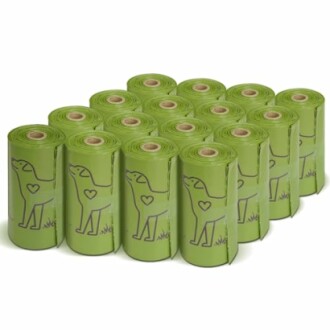 Green biodegradable dog poop bag rolls with dog illustration.