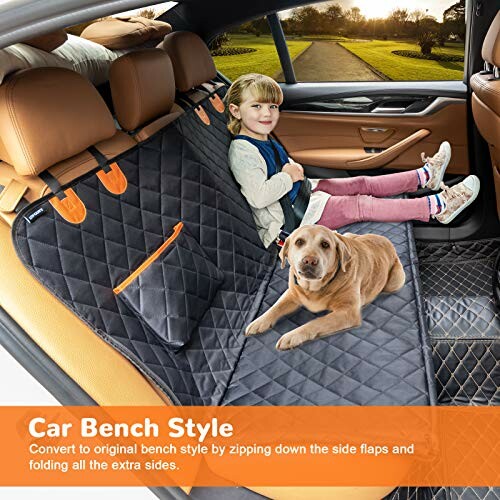 Child and dog on a car bench seat cover with side flaps.