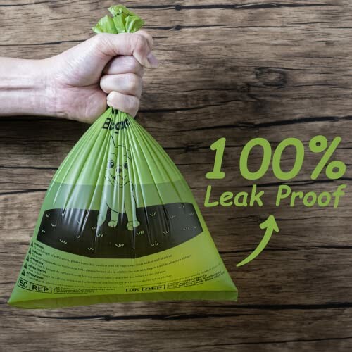 Hand holding a green bag labeled 100% Leak Proof